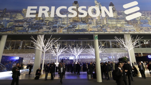 Visitors pass through the entrance to the Ericsson AB pavilion at the Mobile World Congress in Barcelona.