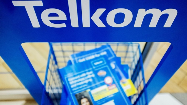 Information brochures sit on display inside a phone store operated by Telkom SA SOC Ltd. at the Menlyn Park shopping center in Pretoria, South Africa, on Tuesday, July 25, 2017. South Africa is evaluating assets it could sell to pay for this month’s 2.2 billion rand ($169.5 million) bailout of unprofitable carrier South African Airways, Finance Minister Malusi Gigaba said in letter to parliament. Photographer: Waldo Swiegers/Bloomberg