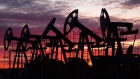 Oil pumping jacks in an oil field at sunset in Russia. Photographer: Bloomberg Creative Photos/Bloomberg Creative Collection