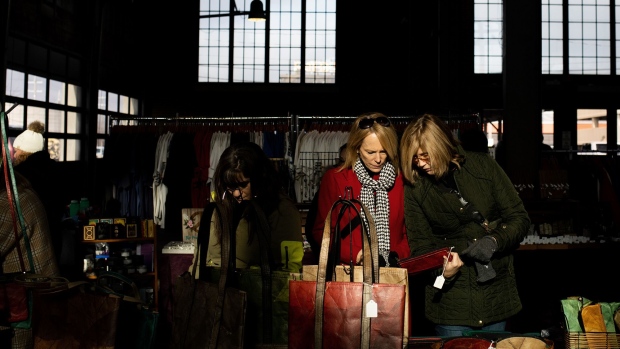 Shoppers at a holiday market in Eastern Market in Detroit, Michigan, on Dec. 11, 2022. Photographer: Emily Elconin/Bloomberg