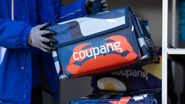 The Coupang Inc. log on an insulted food bag in Daegu, South Korea, on Monday, Feb. 6, 2023. Coupang, the South Korean e-commerce pioneer, has invested about $260 million in the 12-story fulfillment operation in Daegu. Photographer: SeongJoon Cho/Bloomberg