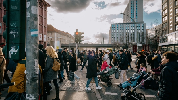 Pedestrians and shoppers cross a road junction in Berlin, Germany, on Saturday, Feb. 4, 2023. Traders will be looking to key data on the German economy next week including January’s preliminary inflation data and industrial production figures. Photographer: Jacobia Dahm/Bloomberg