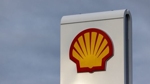 The Shell Plc company logo on a totem sign at the entrance to a petrol station in Billericay, UK, on Wednesday, Feb. 1, 2023. Shell posted a fourth-quarter profit that was well ahead of expectations as its natural gas business thrived, lifting the oil major to a record performance in 2022 fueled by soaring energy prices. Photographer: Chris Ratcliffe/Bloomberg