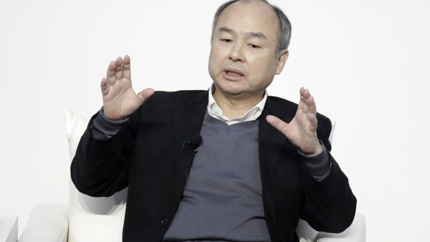 Masayoshi Son, chairman and chief executive officer of SoftBank Group Corp., gestures while speaking during a dialog session with Jack Ma, former chairman of Alibaba Group Holding Ltd., not pictured, at Tokyo Forum 2019 in Tokyo, Japan, on Friday, Dec. 6, 2019. Son unveiled a $184 million initiative Friday to accelerate artificial intelligence research in Japan, enlisting Ma to expound on his goal of commercializing the technology. Son's company announced a partnership with the University of Tokyo that includes spending 20 billion yen ($184 million) over 10 years by mobile arm SoftBank Corp. to establish the Beyond AI Institute.