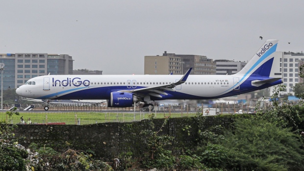 An aircraft operated by IndiGo, a unit of InterGlobe Aviation Ltd., lands at Chhatrapati Shivaji International Airport in Mumbai, India, on Monday, July 25, 2022. InterGlobe Aviation Ltd., is scheduled to release earnings figures on July 27, 2022. Photographer: Dhiraj Singh/Bloomberg