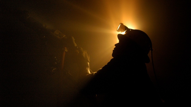 A worker operates a drilling machine 500 meters under ground in a Peru gold mine belonging to the Minerven Co., in El Callao, Venezuela.