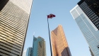 A Canadian flag flies in a courtyard in the financial district of Toronto, Ontario, Canada, on Monday, Jan. 16, 2023. The vacancy rate at Canadian office buildings reached a record high at the end of last year as companies cut back on space while new supply continued to hit the market. Photographer: Galit Rodan/Bloomberg