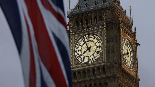 A British Union flag flies near Big Ben at the Palace of Westminster, in London, UK, on Monday, Oct. 24, 2022. Rishi Sunak, former UK international trade secretary, took a huge step toward becoming the UK’s next prime minister as former premier Boris Johnson pulled out of the contest after a weekend of vacillation and as he won the endorsement of Chancellor of the Exchequer Jeremy Hunt. Photographer: Jason Alden/Bloomberg