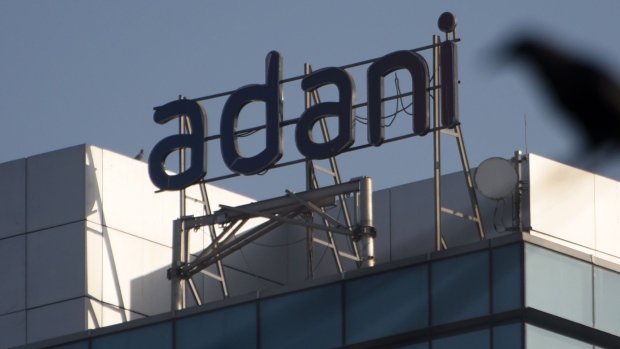 Signage of Adani Group in Mumbai, India, on Wednesday, on Feb. 15, 2023. Adani Group said it has adequate cash reserves and its listed companies are able to refinance their debts, in a credit report aimed at reassuring investors after a critical investigation by US short-seller Hindenburg Research last month.. Photographer: Indranil Aditya/Bloomberg