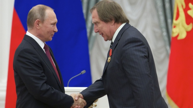 Vladimir Putin and Sergei Roldugin during an award ceremony in Moscow in 2016. Photographer: Ivan Sekretarev/AFP/Getty Images