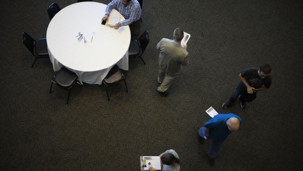 Job seekers attend a Job News USA career fair in Louisville, Kentucky, U.S., on Wednesday, June 23, 2021. The Department of Labor is scheduled to release initial jobless claims figures on June 24.