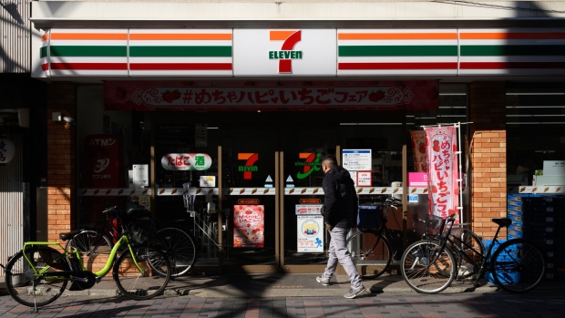 A customer enters a 7-eleven convenience store, operated by Seven & i Holdings Co., in Kawasaki, Kanagawa Prefecture, Japan, on Monday, Jan. 9, 2023. Seven & i Holdings is scheduled to release its earnings figures on Jan. 12. Photographer: Akio Kon/Bloomberg