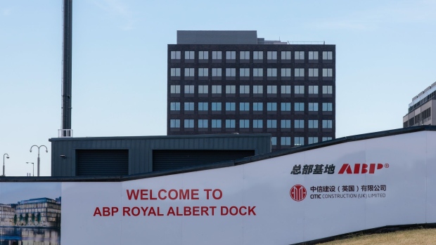 A hoarding surrounds a part of the ABP Royal Albert Dock (RAD) development, by Citic Construction UK Ltd., in London, U.K., on Thursday, July 30, 2020. Overlooking the Thames, along the old Royal Albert Docks and across the water from City Airport, stand more than 20 new buildings that form the first phase of a 1.7 billion-pound ($2.2 billion) project.
