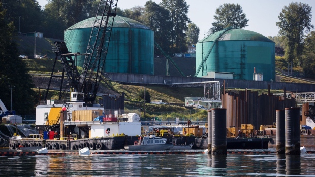 Oil storage tanks sit at the Kinder Morgan Inc. Westridge Marine Terminal during an emergency response exercise in Burnaby, British Columbia, Canada, on Wednesday, Sept. 19, 2018. A Canadian court's decision to nullify approval of the Trans Mountain Expansion Project will increase crude-by-rail transport in the near term and will likely have a "negative impact on Canadian output growth in the longer term," the International Energy Agency said earlier this month.