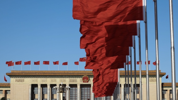 BEIJING, CHINA - MARCH 12: Chinese national flags flutter in front of the Great Hall of the People ahead of the fifth plenary session of the National People's Congress on March 12, 2023 in Beijing, China. China's annual political gathering, known as the Two Sessions, convenes the nation's leaders and lawmakers to set the government's agenda for domestic economic and social development for the next year. (Photo by Lintao Zhang/Getty Images)