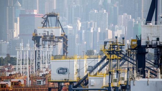 Signage for HongKong International Terminal Ltd. (HIT), a unit of CK Hutchison Holdings Ltd., is displayed on gantry cranes at the Kwai Tsing Container Terminal in Hong Kong, China, on Thursday, Feb. 20, 2020. Hong Kong's container throughput fell 20.4% in January from a year ago according to preliminary figures posted on the Port Development Council's web site. Photographer: Paul Yeung/Bloomberg