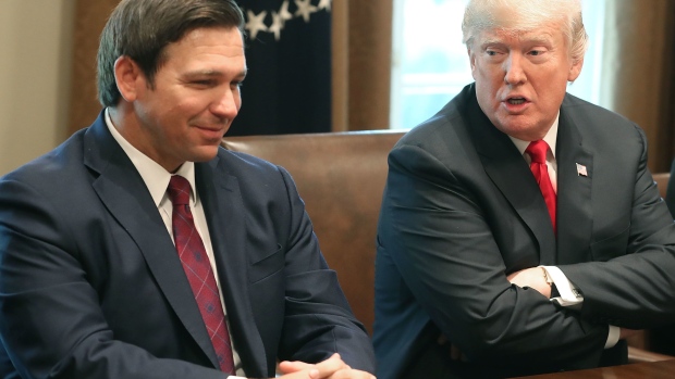 WASHINGTON, DC - DECEMBER 13: Florida Governor-elect Ron DeSantis (R) sits next to U.S. President Donald Trump during a meeting with Governors elects in the Cabinet Room at the White House on December 13, 2018 in Washington, DC. (Photo by Mark Wilson/Getty Images)