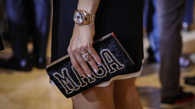 An attendee holds a "MAGA" purse ahead of an announcement by former US President Donald Trump in Palm Beach, Florida, US, on Tuesday, Nov. 15, 2022. Trump is barreling ahead with plans for a third White House run even as a growing number of Republicans abandon the former president over the dismal GOP showing in midterm elections that many in the party blame on him. Photographer: Eva Marie Uzcategui/Bloomberg