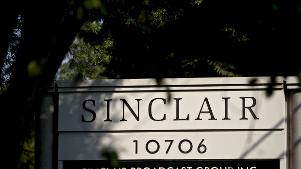 Signage stands outside the Sinclair Broadcast Group Inc. headquarters in Cockeysville, Maryland, U.S., on Friday, Aug. 10, 2018. On Thursday, after months of intense scrutiny from regulators, progressive activists, elected politicians and media watchdog groups, Sinclair's long-pending deal to acquire Tribune Media Co. officially fell apart. Photographer: Andrew Harrer/Bloomberg