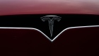 A logo is displayed on a Tesla Inc. electric vehicle charging at the Tesla Supercharger station in Fremont, California, U.S., on Monday, July 20, 2020. Tesla Inc. is scheduled to release earnings figures on July 22. Photographer: Nina Riggio/Bloomberg