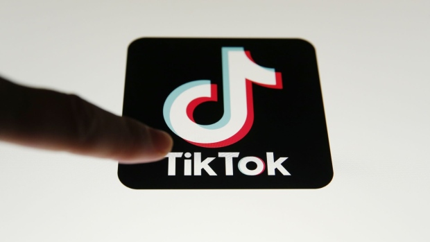 The TikTok app icon sits displayed in this arranged photograph in London, U.K., on Monday, Aug. 3, 2020. TikTok has become a flash point among rising U.S.-China tensions in recent months as U.S. politicians raised concerns that parent company ByteDance Ltd. could be compelled to hand over American users’ data to Beijing or use the app to influence the 165 million Americans, and more than 2 billion users globally, who have downloaded it. Photographer: Hollie Adams/Bloomberg