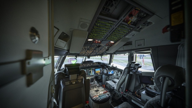The cockpit inside the Boeing 777X test aircraft on the tarmac at Changi Airport, in Singapore, on Sunday, Feb. 13, 2022. The plane is in Singapore as part of the Singapore International Airshow. Photographer: Bryan van der Beek/Bloomberg