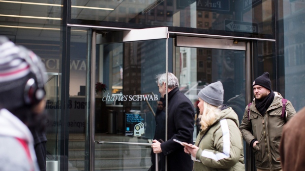 A person enters a Charles Schwab Corp. office building in New York, U.S., on Thursday, Jan. 10, 2019. Charles Schwab Corp. is scheduled to release earnings on January 16.