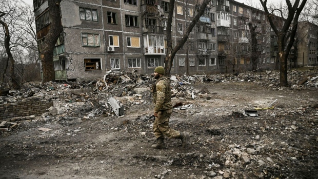A Ukranian serviceman walks among debris following a Russian strike in Chasiv Yar, Ukraine. Photographer: Aris Messinis/AFP/Getty Images