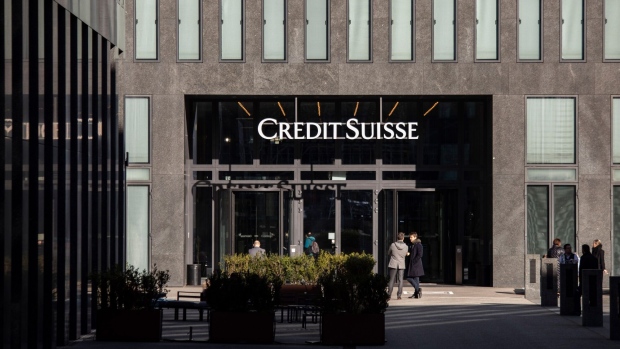 Office workers outside the Credit Suisse Group AG office tower in Zurich, Switzerland, on Thursday, March 16, 2023. Credit Suisse tapped the Swiss National Bank for as much as 50 billion francs ($54 billion) and offered to repurchase debt, seeking to stem a crisis of confidence that has sent shockwaves across the global financial system.