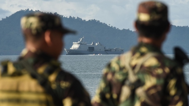 AURORA PROVINCE, PHILIPPINES - MAY 15: Philippine marines look on as the Philippine navy ship BRP Tarlac dock in the foreground on May 15, 2017 in Casiguran Province, Philippines. Philippines and U.S. troops held the annual 'Balikatan' (shoulder-to-shoulder) joint military exercises with an approximately 6,000 participating troops, consisting of some 2,800 Philippine troops and 2,600 U.S. troops. The annual joint exercises are reportedly smaller in scale compared to previous years as directed by President Rodrigo Duterte, who has taken a softer stance than his predecessor toward territorial disputes with China in the South China Sea while expanding security ties with China and Russia. (Photo by Dondi Tawatao/Getty Images) Photographer: Dondi Tawatao/Getty Images AsiaPac