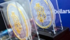 The Bitcoin logo on souvenirs during the listing ceremony for the CSOP Bitcoin Futures and CSOP Ether Futures exchange-traded funds (ETFs) at the Hong Kong Stock Exchange in Hong Kong, China, on Friday, Dec. 16, 2022. A pair of Hong Kong ETFs investing in Bitcoin and Ether futures raised $79 million as the city pushes ahead with a plan to become a crypto hub even as the sector globally reels from the FTX collapse. Photographer: Paul Yeung/Bloomberg
