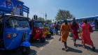 People walk past the three-wheelers in Colombo, Sri Lanka, on Monday, March 13, 2023. Sri Lanka’s GDP likely shrank at a slower pace on a quarter-on-quarter basis in the fourth quarter of 2022, falling 0.5% quarter on quarter, less than a 6.1% drop in the third quarter of 2022, according to Bloomberg Economics' estimates. Photographer: Thilina Kaluthotage/Bloomberg