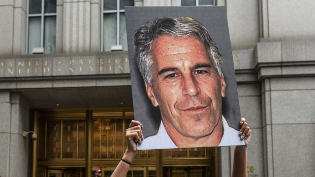 A protester holds up a sign of Jeffrey Epstein in front of the federal courthouse in New York on July 8, 2019. Photographer: Stephanie Keith/Getty Images