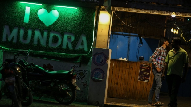 I love Mundra sign outside a restaurant in Mundra, Gujarat, India, on Wednesday, Feb. 8, 2023. Adani Group has slashed revenue target by half to about 15%-20%, aiming to save cash, repay debt and restore investor confidence, according to people familiar with the matter. Photographer: Dhiraj Singh/Bloomberg