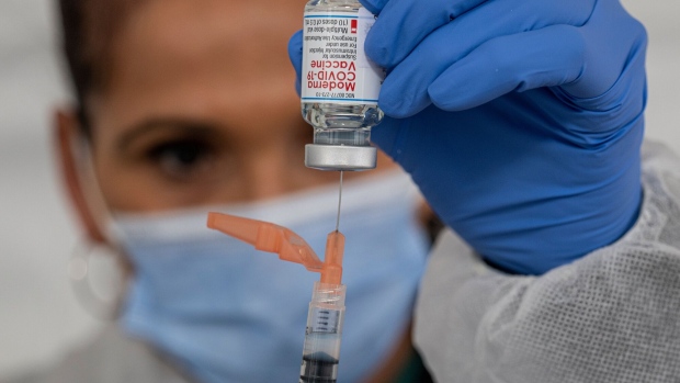 A healthcare worker prepares a dose of the Moderna Covid-19 vaccine at a walk up vaccination site in San Francisco, California, U.S., on Wednesday, Feb. 3, 2021. San Francisco opened its first neighborhood coronavirus vaccination site in the Mission District on Monday, with plans to open a second in the Bayview in the coming days, reported the San Francisco Chronicle. Photographer: David Paul Morris/Bloomberg