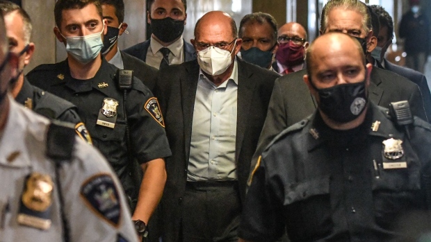 Allen Weisselberg, center, is escorted to a courtroom in New York, on July 1, 2021.