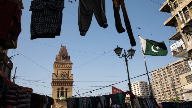 Clothes are on display among the electricity cables outside Empress Market in Karachi, Pakistan, on Monday, Oct. 24, 2022. Pakistan is expected to announce its consumer price index on November 1. Source: Bloomberg/Bloomberg