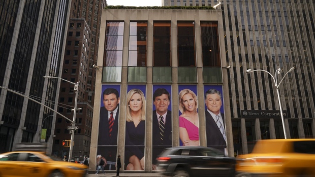NEW YORK, NY - MARCH 13: Traffic on Sixth Avenue passes by advertisements featuring Fox News personalities, including Bret Baier, Martha MacCallum, Tucker Carlson, Laura Ingraham, and Sean Hannity, adorn the front of the News Corporation building, March 13, 2019 in New York City. On Wednesday the network's sales executives are hosting an event for advertisers to promote Fox News. Fox News personalities Tucker Carlson and Jeanine Pirro have come under criticism in recent weeks for controversial comments and multiple advertisers have pulled away from their shows. (Photo by Drew Angerer/Getty Images) Photographer: Drew Angerer/Getty Images
