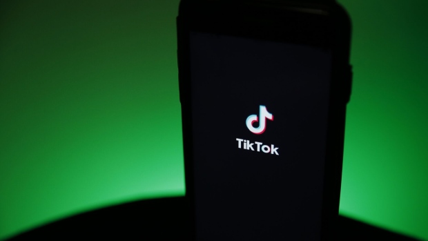 The TikTok logo is displayed on a smartphone in this arranged photograph in London, U.K., on Monday, Aug. 3, 2020. TikTok has become a flash point among rising U.S.-China tensions in recent months as U.S. politicians raised concerns that parent company ByteDance Ltd. could be compelled to hand over American users’ data to Beijing or use the app to influence the 165 million Americans, and more than 2 billion users globally, who have downloaded it.