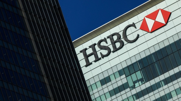 A logo sits on the HSBC Holdings Plc headquarter skyscraper offices in the Canary Wharf business, financial and shopping district in London, U.K., on Tuesday, May 2, 2017. HSBC has appeased investors with $3.5 billion of share buybacks, but after five years of declining revenue analysts are looking for evidence the bank is stabilizing its top line when it reports earnings Thursday.