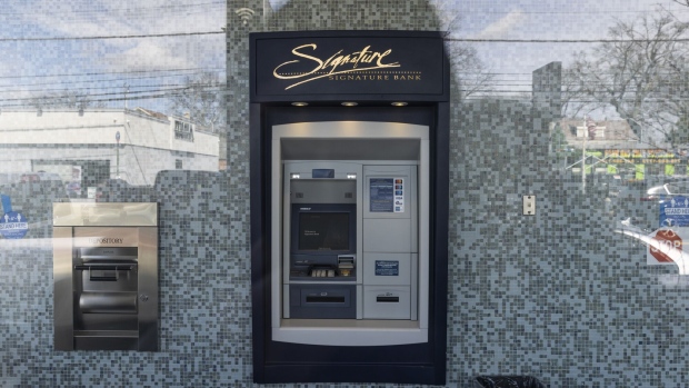 An automatic teller machine (ATM) at a Signature Bank branch in the Staten Island borough of New York, US, on Wednesday, March 15, 2023. Signature’s collapse on Sunday was the third-largest bank failure in the US ever, behind Washington Mutual in 2008 and Silicon Valley Bank’s cataclysmic drop days ago.