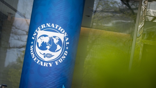 Signage outside the International Monetary Fund (IMF) headquarters in Washington, D.C., U.S., on Tuesday, April 19, 2022. The IMF slashed its world growth forecast by the most since the early months of the Covid-19 pandemic, and projected even faster inflation, after Russia invaded Ukraine and China renewed virus lockdowns.
