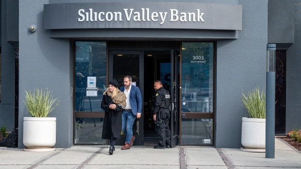 Customers exit Silicon Valley Bank headquarters in Santa Clara, California, US, on Monday, March 13, 2023. The collapse of Silicon Valley Bank has prompted a global reckoning at venture capital and private equity firms, which found themselves suddenly exposed all together to the tech industry's money machine.