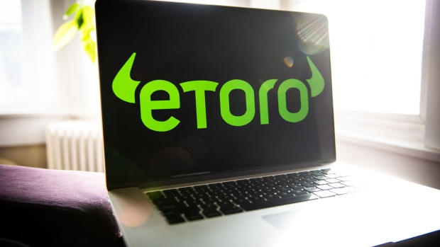 The EToro logo on a laptop computer arranged in Dobbs Ferry, New York, U.S., on Saturday, May 22, 2021. Elon Musk continued to toy with the price of Bitcoin Monday, taking to Twitter to indicate support for what he says is an effort by miners to make their operations greener. Photographer: Tiffany Hagler-Geard/Bloomberg
