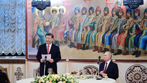 Xi Jinping gives a speech as Vladimir Putin listens during a reception following their talks at the Kremlin in Moscow on March 21. Photographer: Pavel Byrkin/AFP/Sputnik/Getty Images