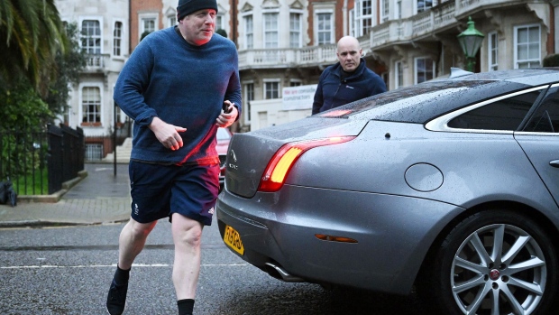 Boris Johnson returns after a run, in London on March 22. Photographer: Justin Tallis/AFP/Getty Images