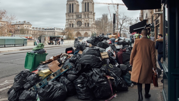 Uncollected bags of trash near Notre Dame cathedral in Paris. Photographer: Cyril Marcilhacy/Bloomberg