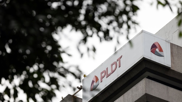 Signage at the PLDT Inc. headquarters in Makati City, Metro Manila, the Philippines, on Monday, Dec. 19, 2022. PLDT, the largest Philippine phone company, sank as a 48 billion peso ($866 million) four-year capital spending overrun raised questions about its corporate governance and fiscal control.