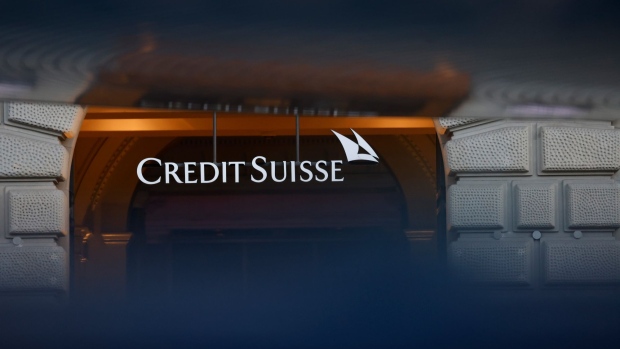 A sign above the entrance to the Credit Suisse Group AG headquarters in Zurich, Switzerland, on Tuesday, March 21, 2023. Recruiters across the world are getting an unprecedented flood of calls from Credit Suisse bankers seeking new jobs as the embattled Swiss lender is set to be taken over by UBS Group AG.