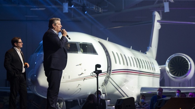 Eric Martel, left, at a delivery ceremony for NetJets’ first Bombardier Global 7500.